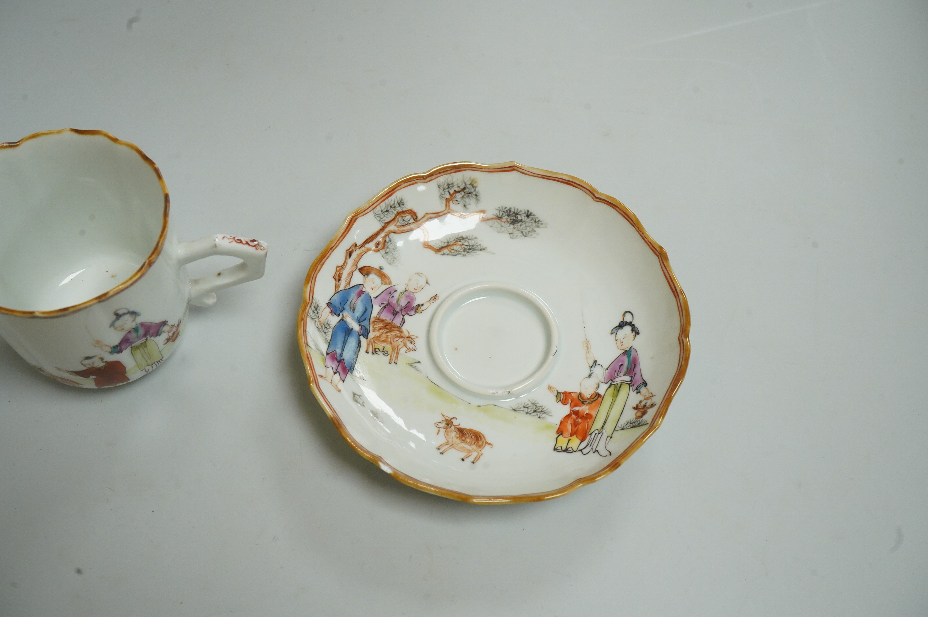 A Chinese export famille rose chocolate cup and trembleuse saucer, Qianlong period, saucer 13cm in diameter